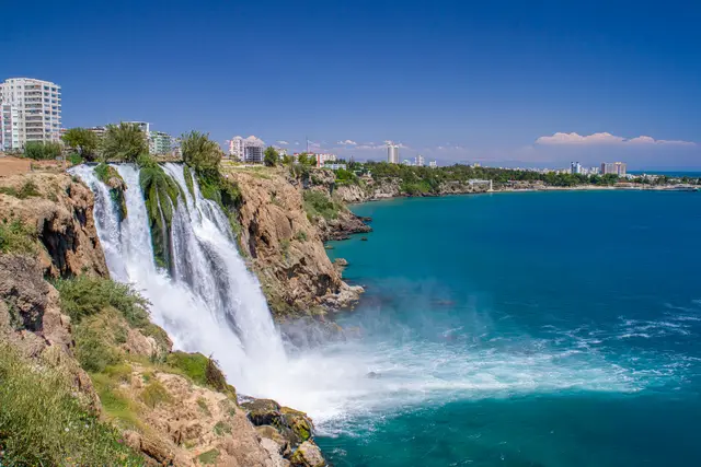 Lower Düden Waterfall pouring off the cliffs into the sea