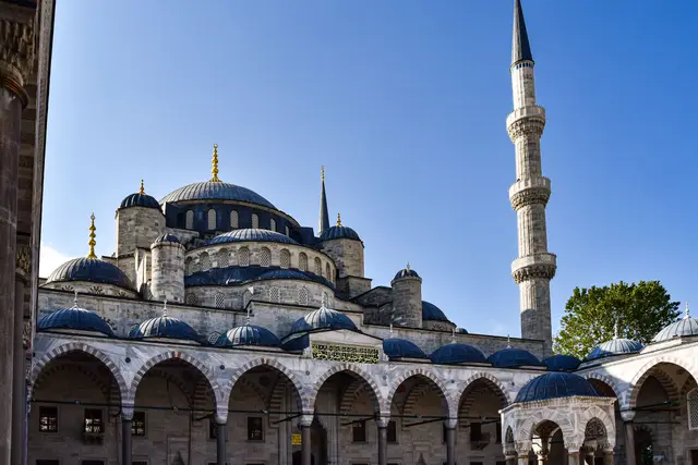 The courtyard, domes and a minaret of the Blue Mosque