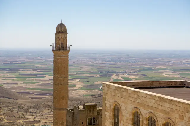 The minaret of Mardin's Great Mosque above the plain