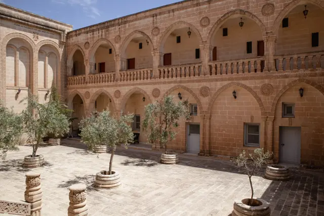 The arcaded courtyard and olive trees of Mor Gabriel Monastery